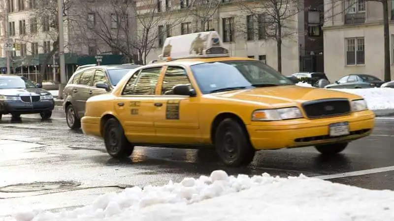City street in winter showing why you need the best ice cleats for Mentor, OH.