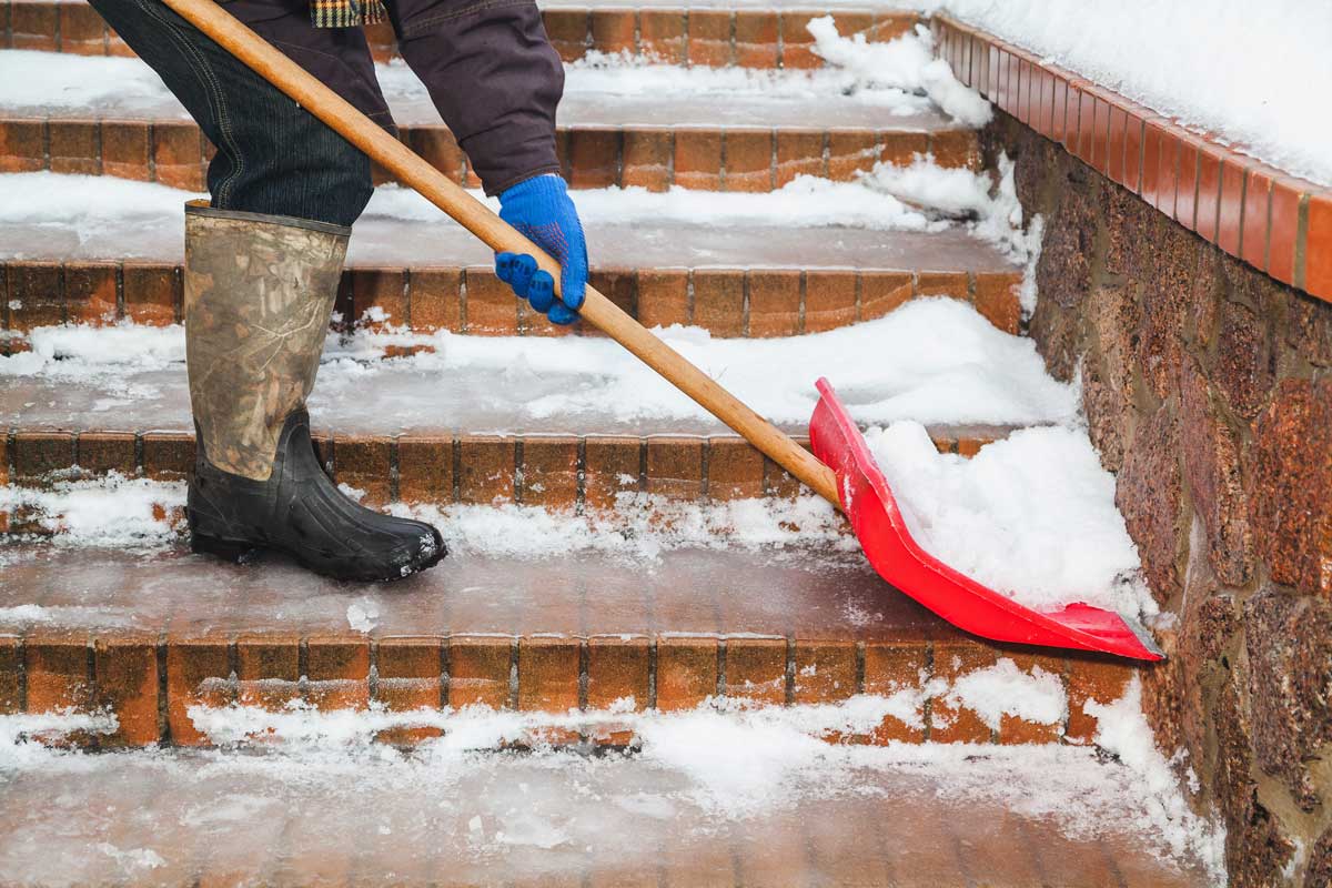 Shoveling snow on icy steps requires the best ice cleats for safety.